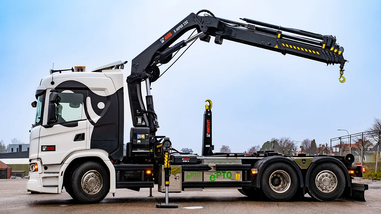 Commercial loader crane unloading heavy pallets in Brentwood